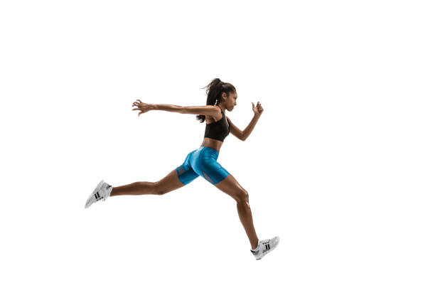 young african woman running or jogging isolated on white studio background. - running women jogging profile imagens e fotografias de stock