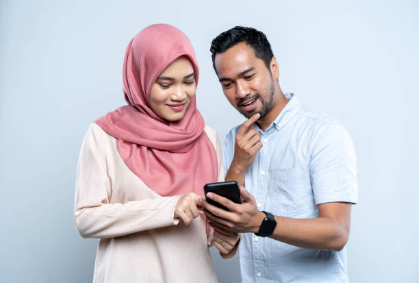 Asian Malay couple doing online shopping on mobile phone Asian Malay couple doing online shopping on mobile phone

Location: Malaysia, Kuala Lumpur

iStockalypse KL malay couple stock pictures, royalty-free photos & images