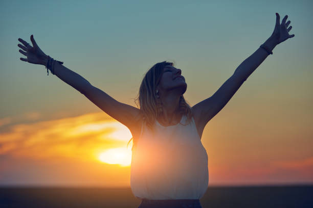 istock Cute young woman jumping in a wheat field. 1135780516