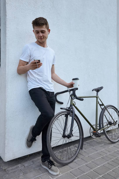 istock Handsome hipster man posing with bicycle in the city. 1135780711