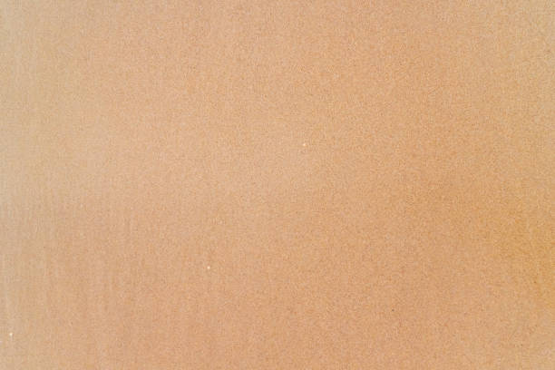 istock Smooth brown sand on the beach texture. Perfect for background. 1135780946