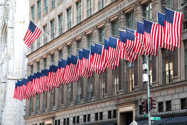 istock American Flags Against Office Building 1135781498