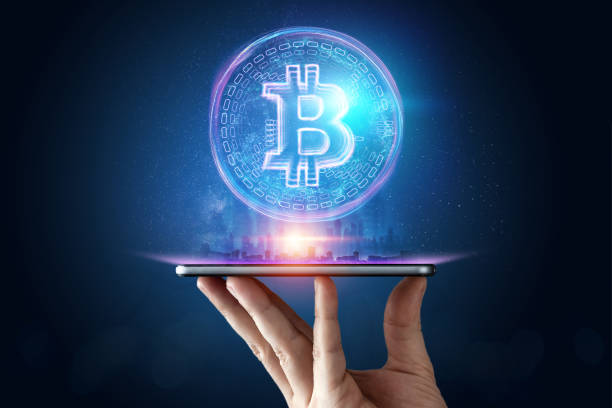 istock Male hand, bitcoin hologram, ultraviolet creative background. Cryptocurrency, electronic money, blockchain technology, finance, copy space. 1135785663