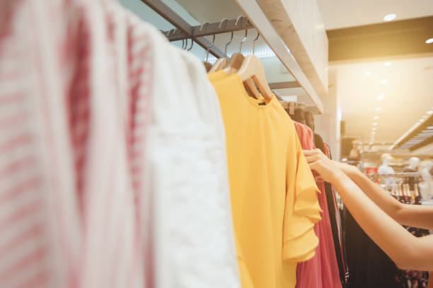 istock Looking for brightly colored clothes on hangers 1135785950
