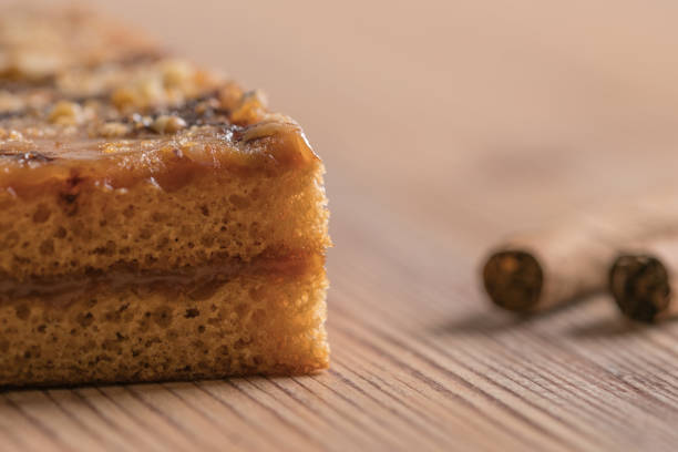 Cake and cigar on wood table