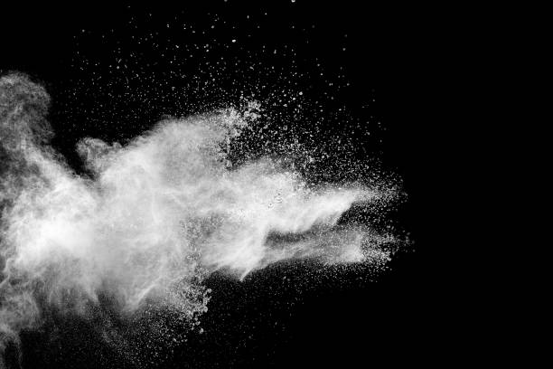 istock White powder explosion isolated on black background. White dust particles splash.Color Holi Festival. 1135787274