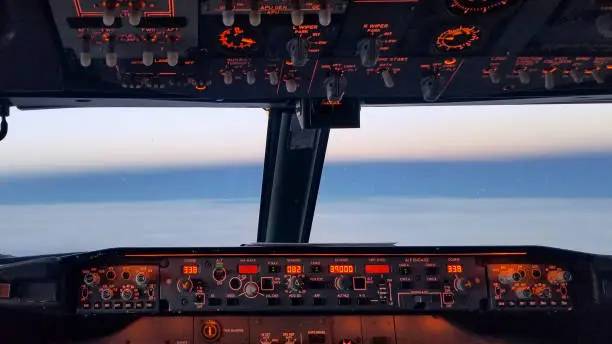 glowing buttons and sky from cockpit