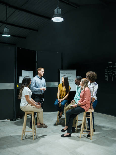 istock Millennial young businessman training staff 1135789044