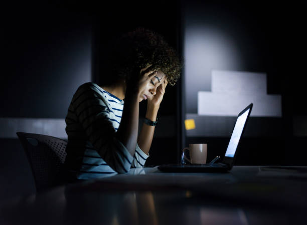 istock Exhausted young businesswoman 1135789082
