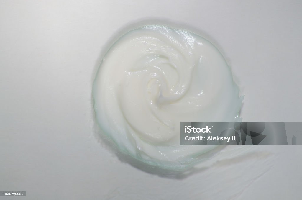 Cream on white. A sample of cosmetics. Smear cream for face. Horizontal Stock Photo