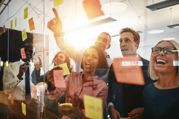 istock Diverse businesspeople celebrating after a successful brainstorming session 1135790240