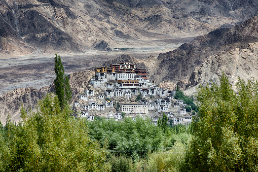 Thikse Monastery seen from the opposite side of Indus River. Thikse Monastery (also Thiksay Gompa) is a monastery affiliated with the Gelug sect of Tibetan Buddhism. It is located on top of a hill in Thiksey village, approximately 19 kilometres east of Leh in Ladakh, India. It is located at an altitude of 3,600 metres (11,800 ft) in the Indus Valley.