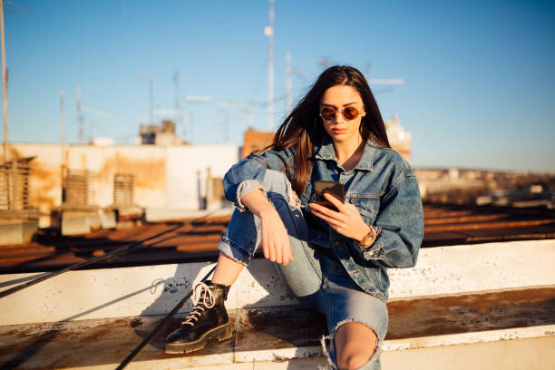 istock A young woman sitting on the rooftop 1135791815