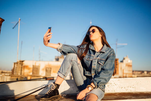 istock A young woman sitting on the rooftop 1135791843