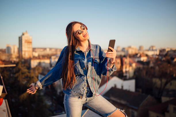 istock A young woman sitting on the rooftop 1135791962