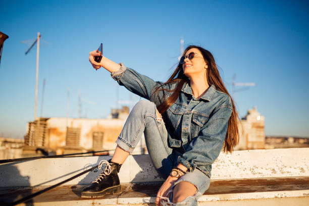 istock A young woman sitting on the rooftop 1135792048