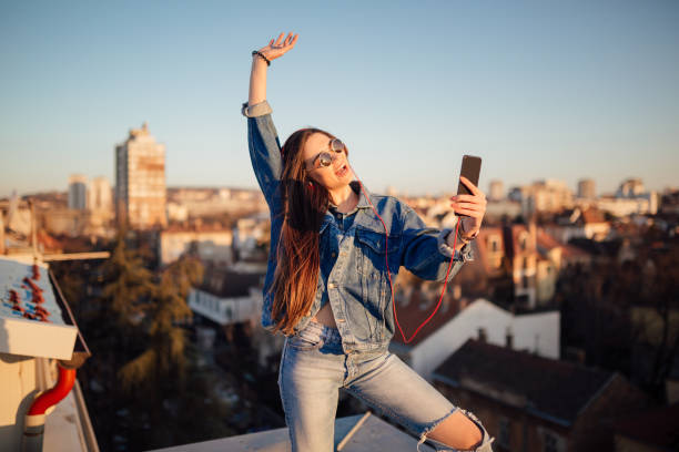 istock A young woman sitting on the rooftop 1135792088
