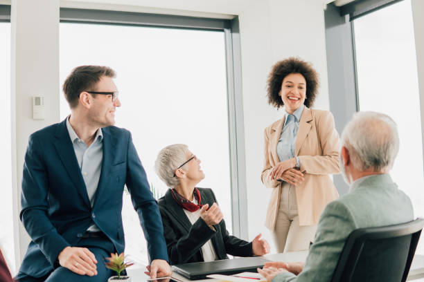 istock Coworkers sharing a laugh at office 1135792264