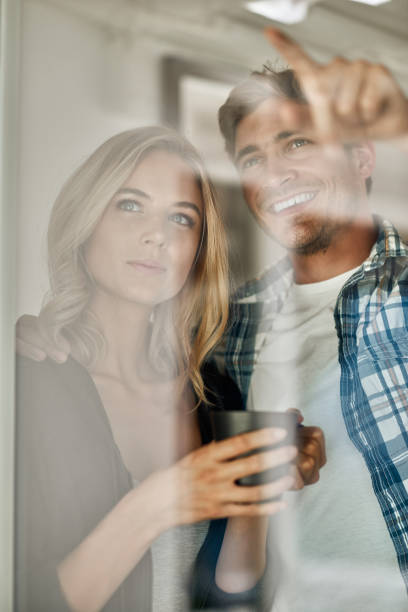 istock Cute joyful couple cooking together and having fun in the kitchen 1135793110