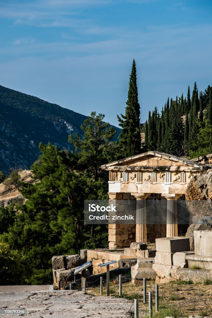 Temple of Apollo and Altar of Chiots in Delphi, Greece Altar of Chiots and Temple of Apollo in archaeological site of Delphi, Greece Altar Stock Photo