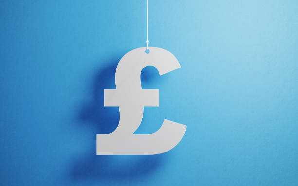 istock Currency Concept - White British Pound Symbol  With String Over Blue Background 1135794572