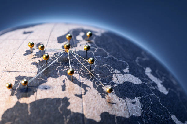 istock European Connection - Golden pins on cork board globe 1135794580