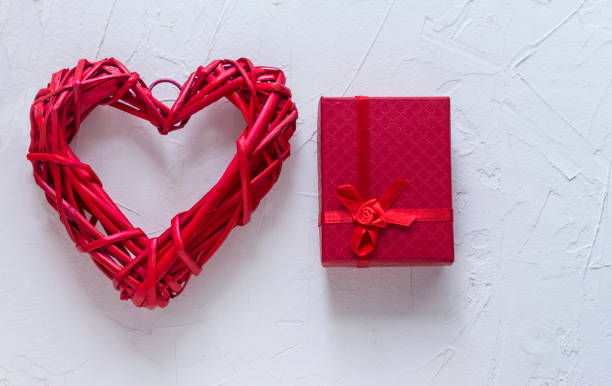 istock red braided heart and gift box with copy space 1135794763