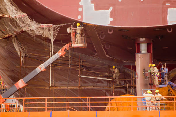 People working in a harbor on a construction site in Shanghai on October 3,  2011. Shanghai serves as the main seaport of the world