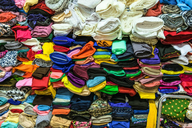 Fabric Store Warehouse With Stacked Colored Rolls Of Fabrics For Sewing  Stock Photo - Download Image Now - iStock