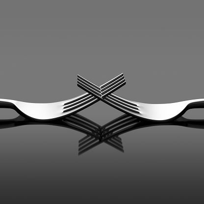 Two forks. Geometry symmetry lines studio shot.