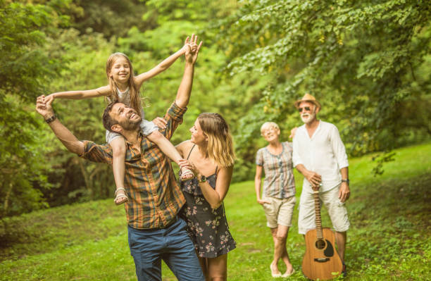 istock Happy multi generation family enjoying quality time together in nature. 1135801656