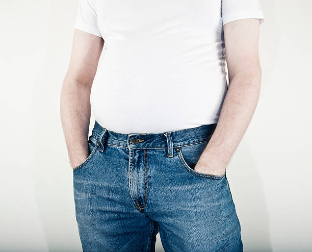 男性、余分な体重を中央周り - abdomen too small jeans overweight ストックフォトと画像