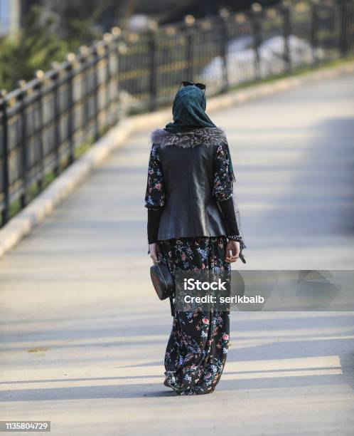 Muslim Woman Walking Along The Road In The Park Stock Photo - Download Image Now - Iran, Street, Adult
