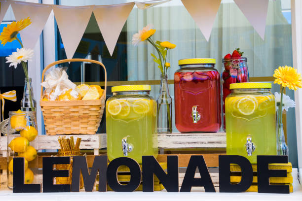 istock Decorative Summer Lemonade Stand With Freshly Squeezed Fruit Juice, Pastries and Flowers 1135807870