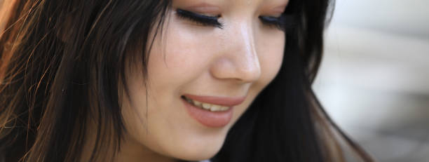 istock Young beautiful brunette woman with beautiful eyebrows, eyes closed 1135808165