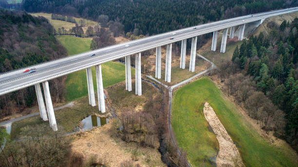 istock Highway bridge through forest area - aerial view 1135810385