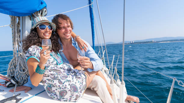 istock Couple drinking and toasting with champaigne on a yacht 1135814170