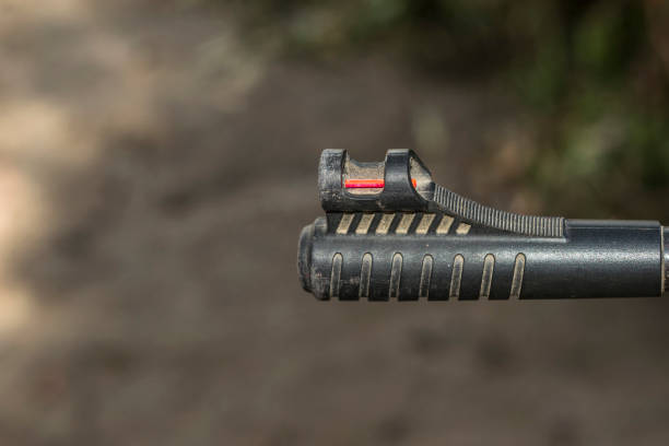 istock an automatic riffle gun aim in the darkness 1135815290