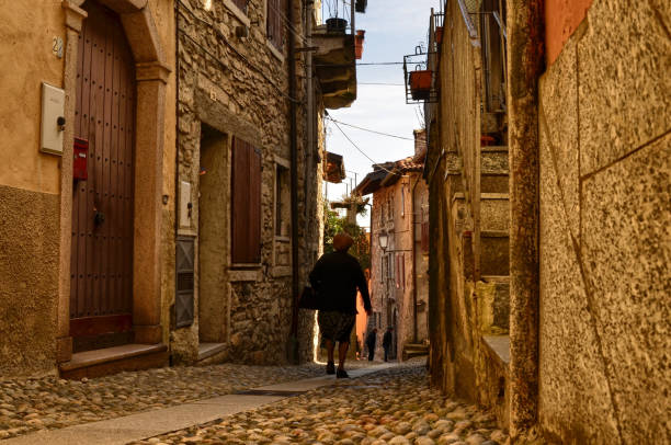 Mergozzo, Piedmont, Italy. March 2019. On the hill near the lake the village is one of the most beautiful villages in Italy. Intimate glimpses of narrow lanes occasionally reveal the lake.
