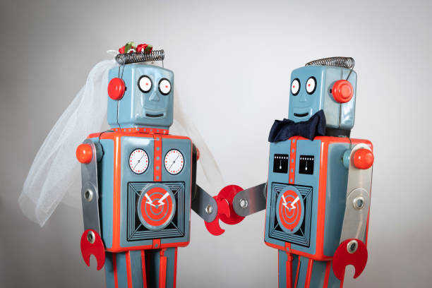istock Close up of toy robots getting married 1135816581