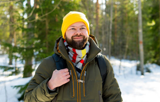istock Young handsome man in the winter forest in Finland 1135817786