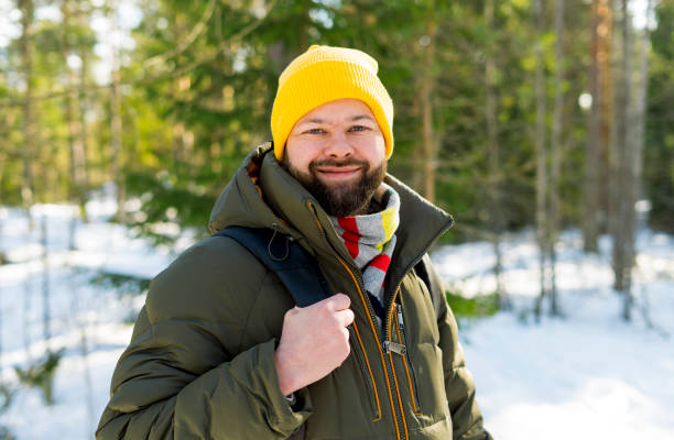 istock Young handsome man in the winter forest in Finland 1135817787