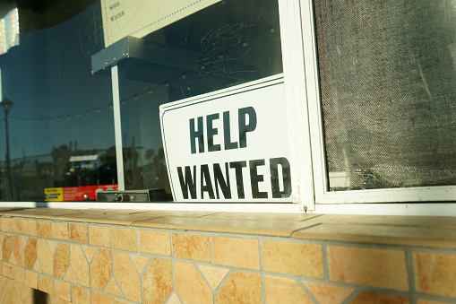 shot of help wanted sign