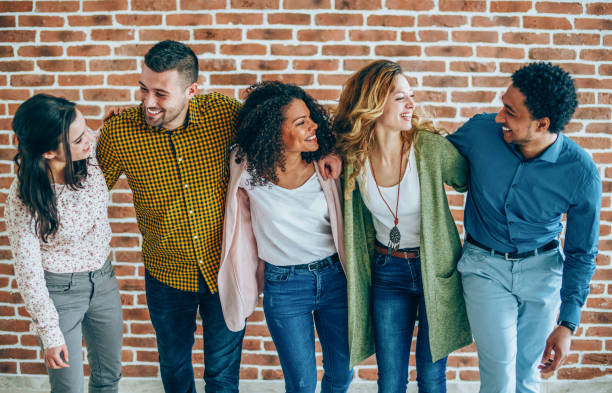 istock Young happy cheerful students in campus 1135821542