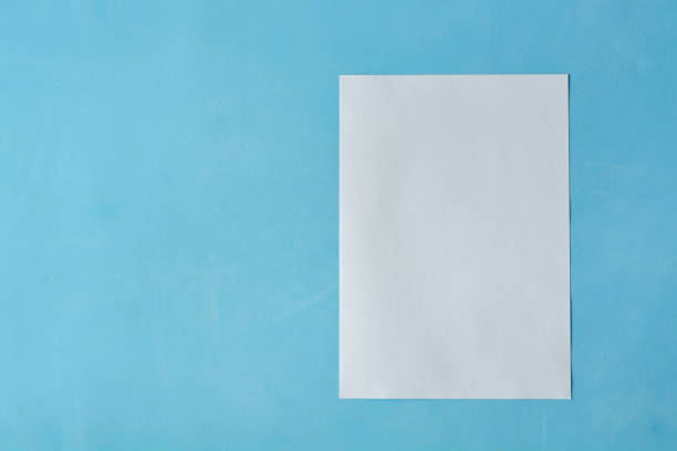 istock White sheet paper isoleted on the light blue background. 1135821560