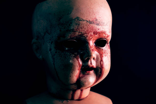 istock Creepy bloody doll in the dark 1135821829