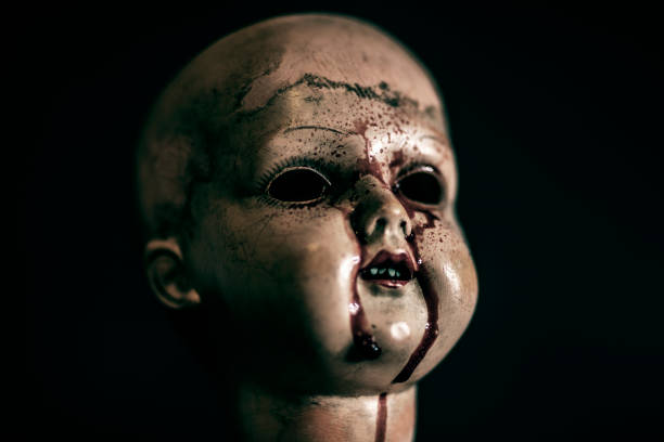 istock Creepy bloody doll in the dark 1135821832