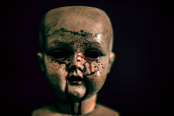 istock Creepy bloody doll in the dark 1135822724