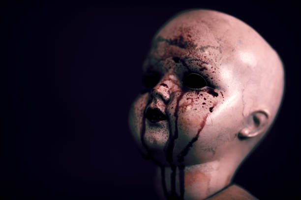 istock Creepy bloody doll in the dark 1135822797