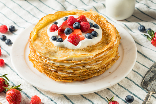 Sweet Homemade Layed Crepe Cake with Berries and Whippe Cream